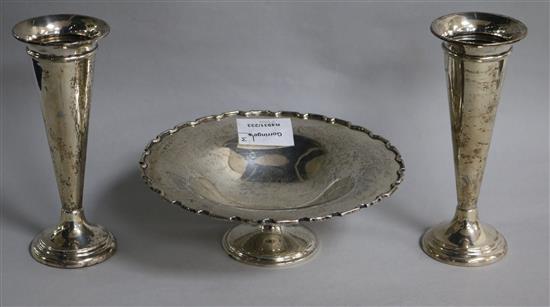 A pair of Edwardian silver spill vases and a George V silver pedestal dish by Elkington & Co, bowl diameter 18cm.